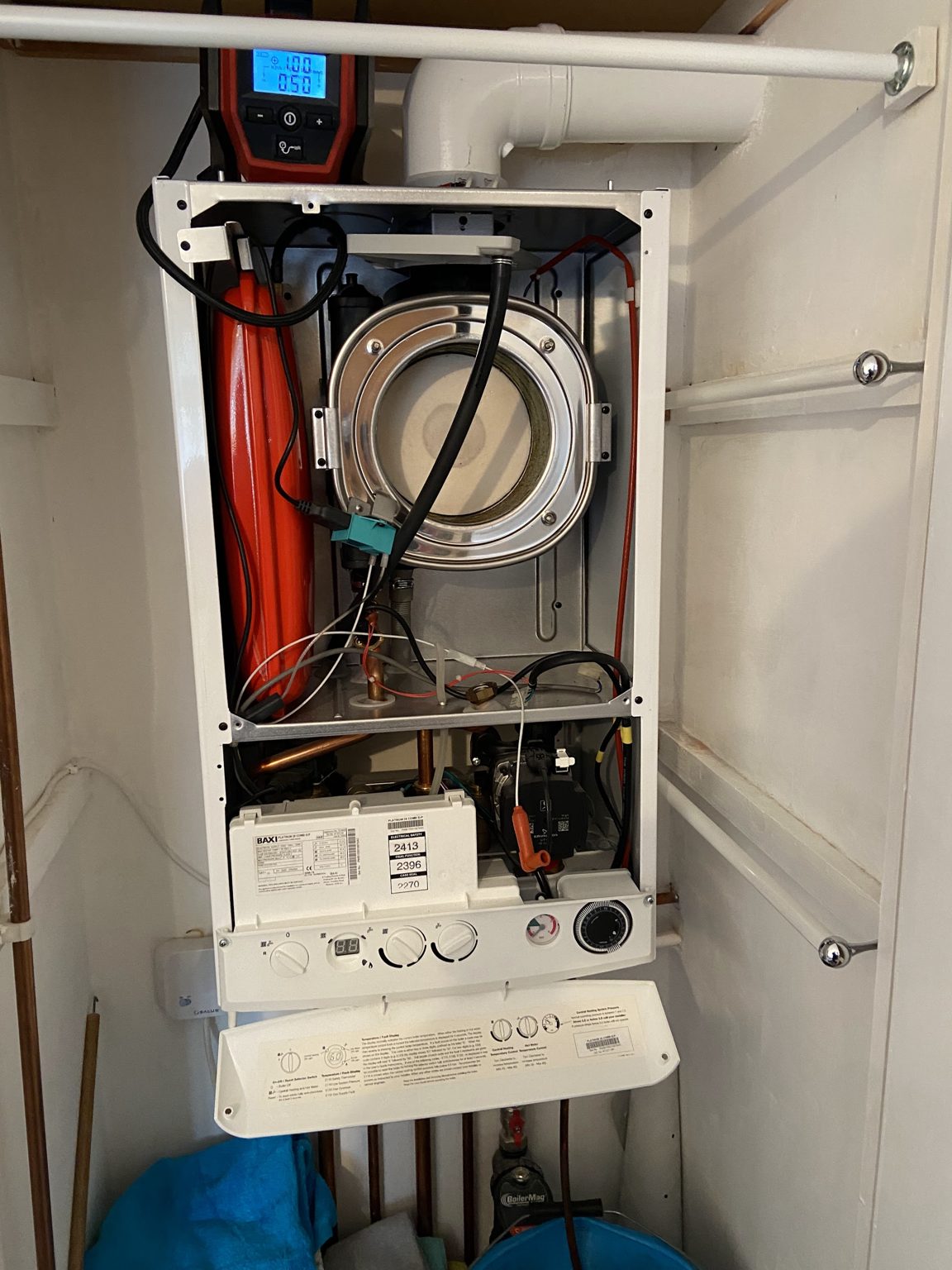 A boiler opened up for its annual service with a flue gas analyser connected